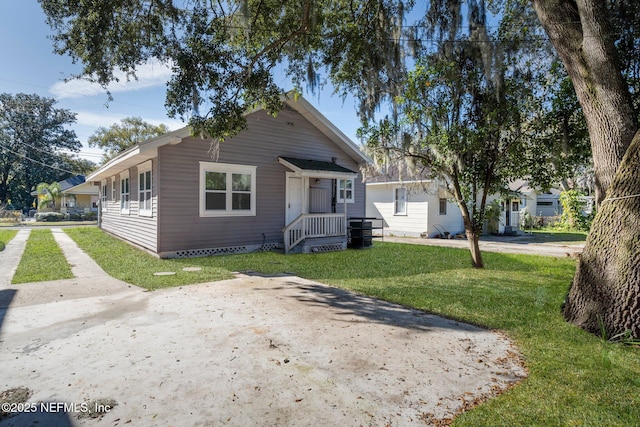 bungalow-style house with a front lawn