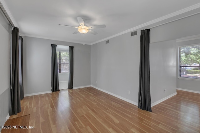 empty room with light wood-type flooring, ceiling fan, and crown molding