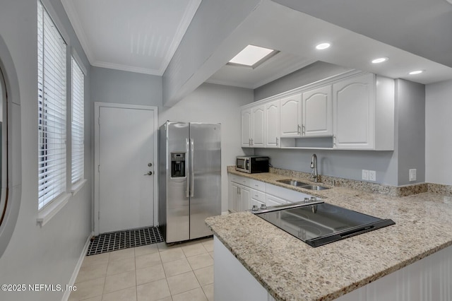 kitchen with light stone countertops, sink, stainless steel appliances, white cabinets, and ornamental molding