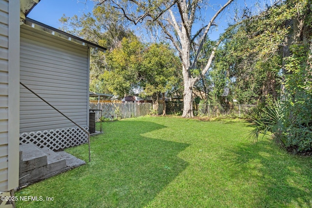 view of yard featuring central air condition unit