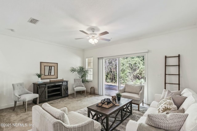 living room with ceiling fan and crown molding