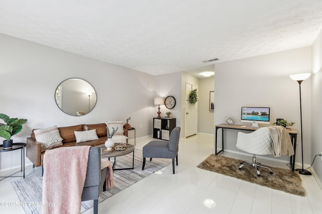 living room with a textured ceiling