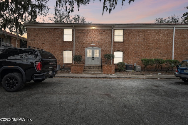 view of front of property with central air condition unit and french doors