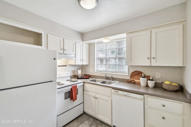 kitchen featuring a textured ceiling, white appliances, white cabinetry, and sink