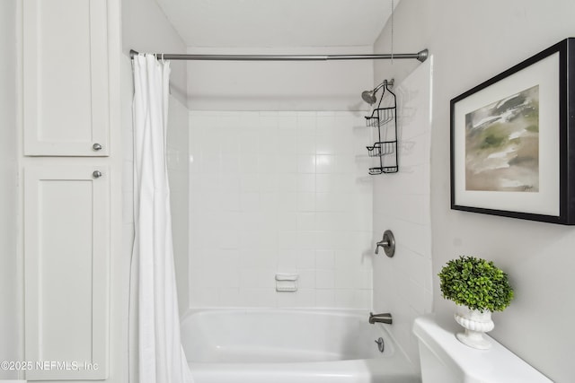 bathroom featuring shower / tub combo with curtain and toilet