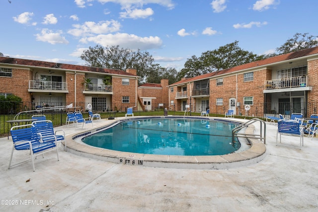 view of swimming pool with a patio area