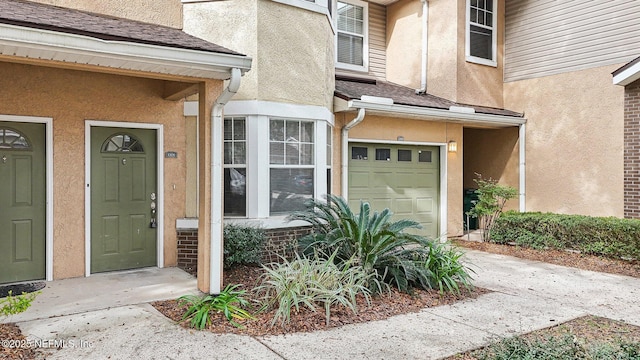 property entrance with a garage