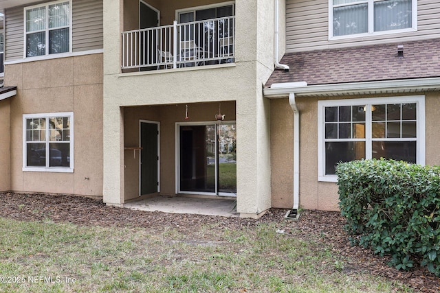 entrance to property with a patio area