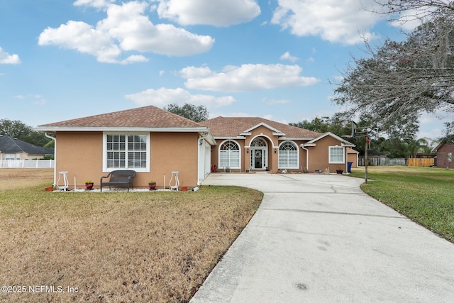 ranch-style house with a front lawn