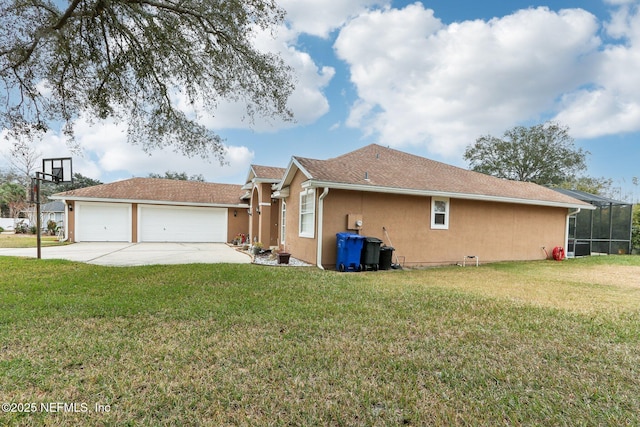 view of property exterior featuring a garage and a yard