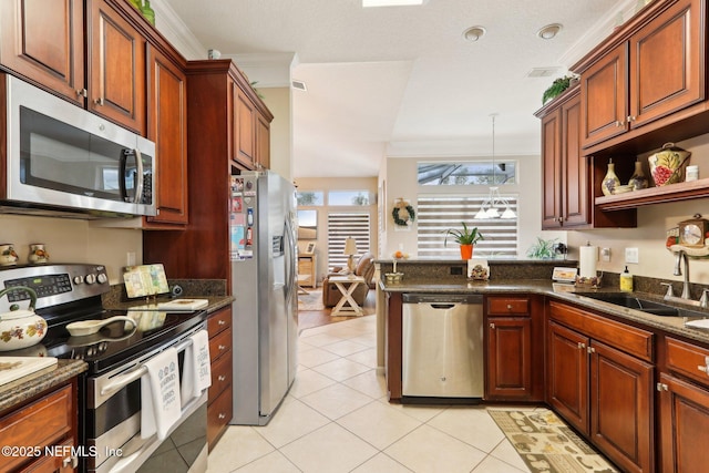 kitchen with sink, crown molding, light tile patterned flooring, and appliances with stainless steel finishes