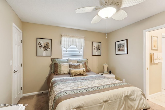 bedroom featuring ceiling fan and carpet