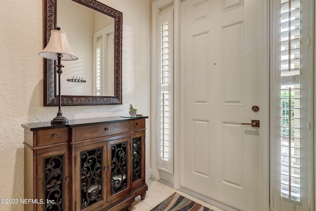 entrance foyer with light tile patterned floors