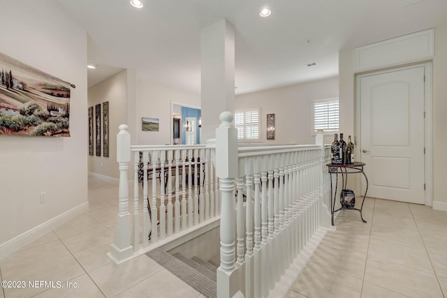 hallway with light tile patterned floors