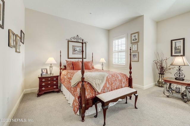 bedroom featuring light carpet