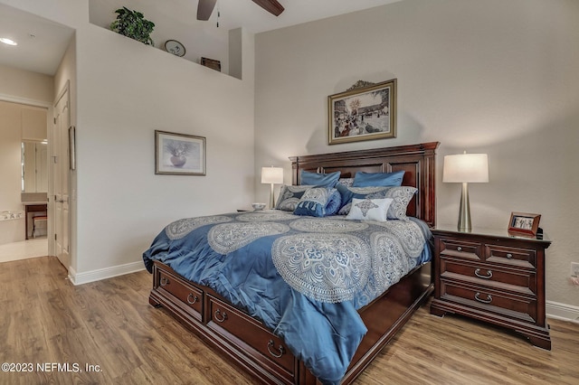 bedroom with hardwood / wood-style flooring and ceiling fan