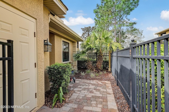 view of side of property with a patio area