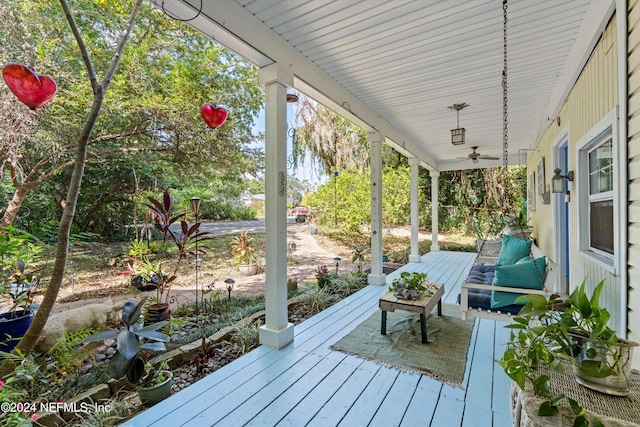 wooden terrace with a porch