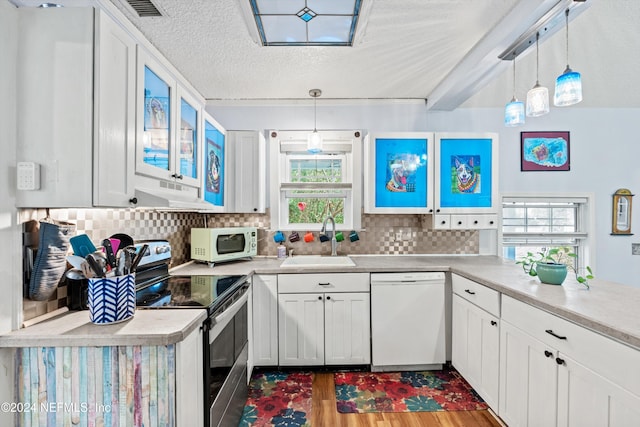 kitchen with white cabinetry, sink, pendant lighting, a textured ceiling, and white appliances