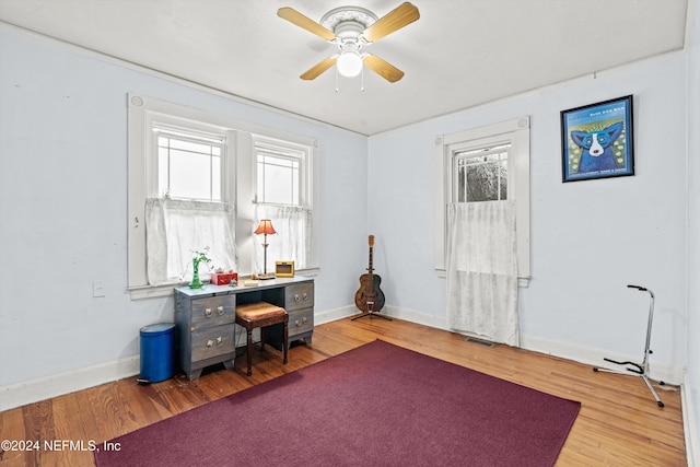 office space with hardwood / wood-style floors and ceiling fan