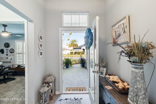 entryway featuring ceiling fan, wood-type flooring, and french doors