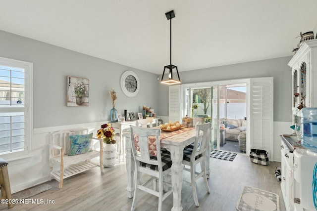 dining area featuring light wood-type flooring and a wealth of natural light