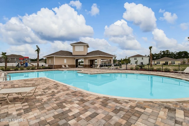 view of pool featuring a patio