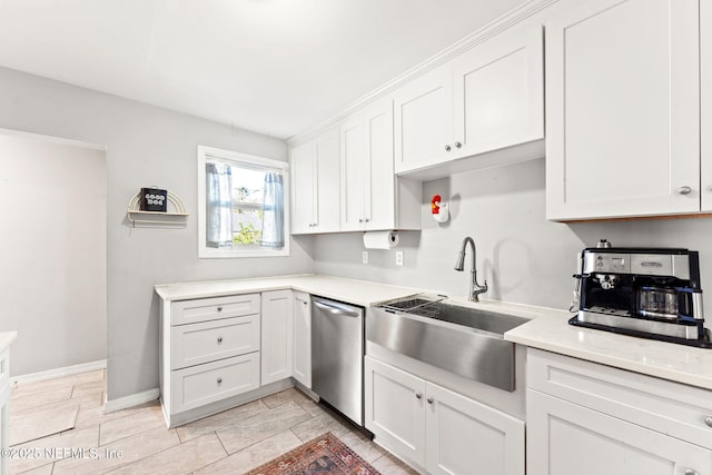 kitchen featuring white cabinets, stainless steel dishwasher, and sink