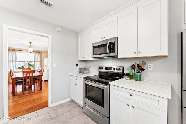 kitchen with white cabinets and stainless steel appliances