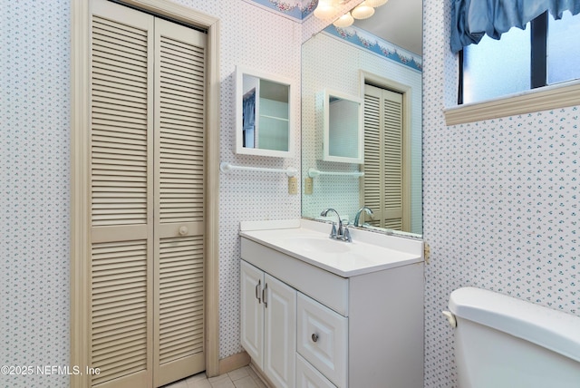 bathroom with vanity and toilet