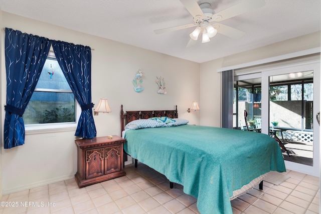 tiled bedroom featuring multiple windows and ceiling fan