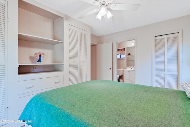 bedroom featuring ceiling fan, connected bathroom, and multiple closets