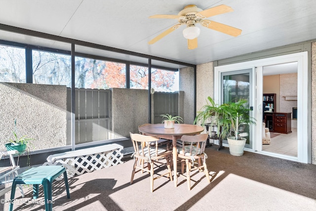 sunroom / solarium with ceiling fan