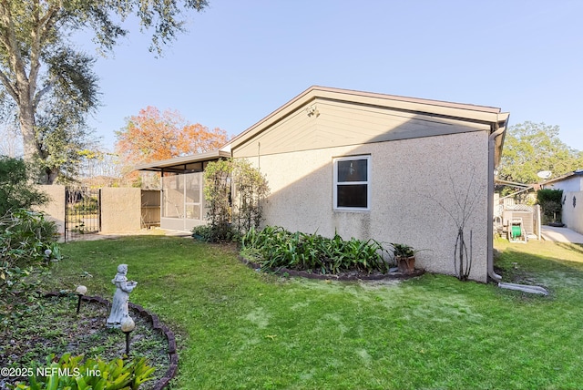 view of property exterior with a lawn