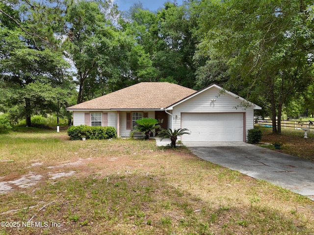 ranch-style house with a garage and a front lawn