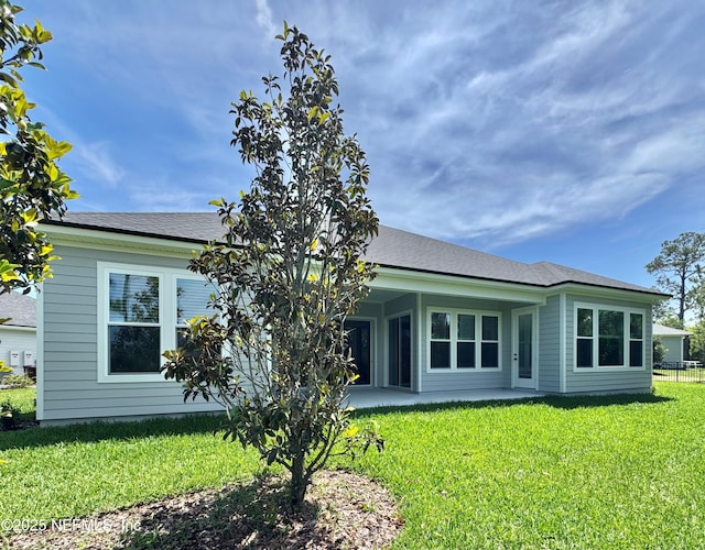 44 Vega Ct, Saint Augustine, FL 32095 - rear view of house with a patio and a yard