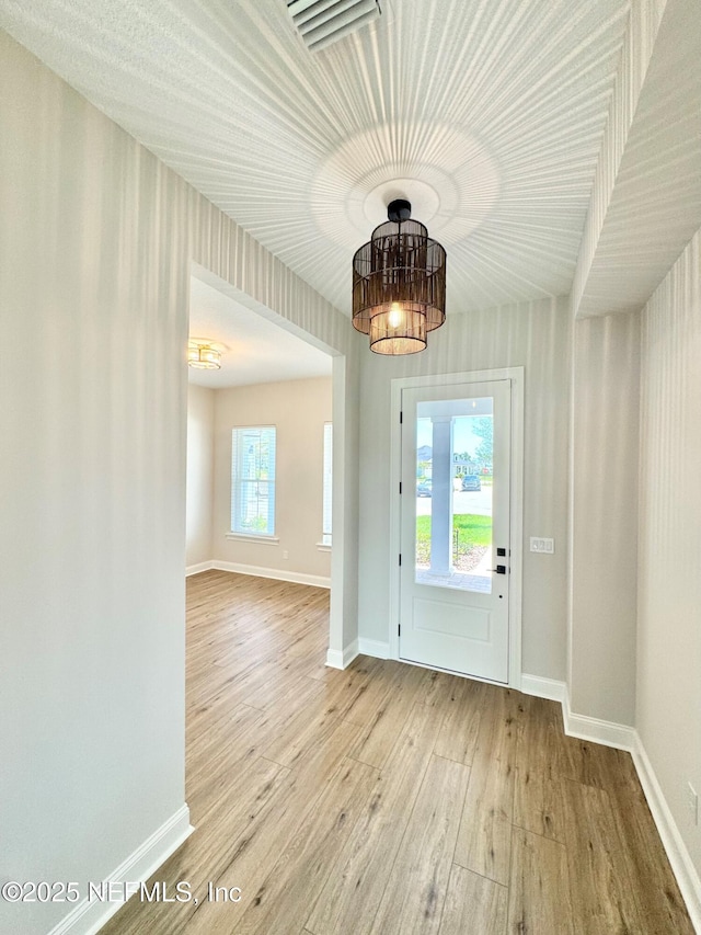 44 Vega Ct, Saint Augustine, FL 32095 - entryway featuring baseboards, visible vents, and hardwood / wood-style floors