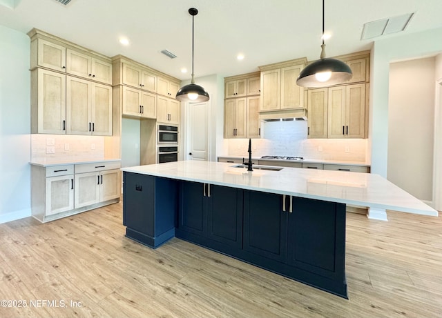 44 Vega Ct, Saint Augustine, FL 32095 - kitchen featuring visible vents, decorative backsplash, a sink, and light wood-type flooring