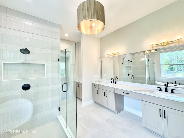44 Vega Ct, Saint Augustine, FL 32095 - bathroom featuring double vanity, a sink, a stall shower, and tile patterned floors