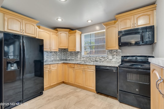 kitchen featuring light brown cabinets, black appliances, sink, light stone countertops, and tasteful backsplash