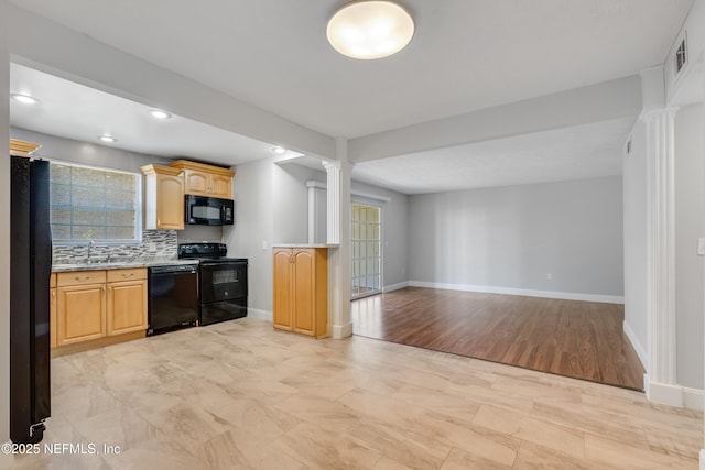 kitchen featuring sink, light hardwood / wood-style flooring, decorative columns, decorative backsplash, and black appliances