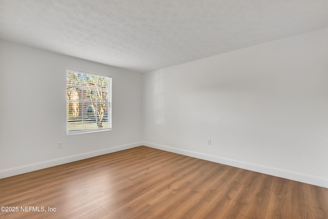 empty room featuring hardwood / wood-style floors