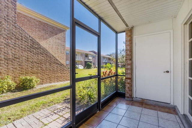 unfurnished sunroom with a wealth of natural light