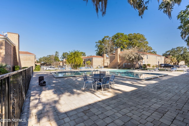 view of swimming pool featuring a patio