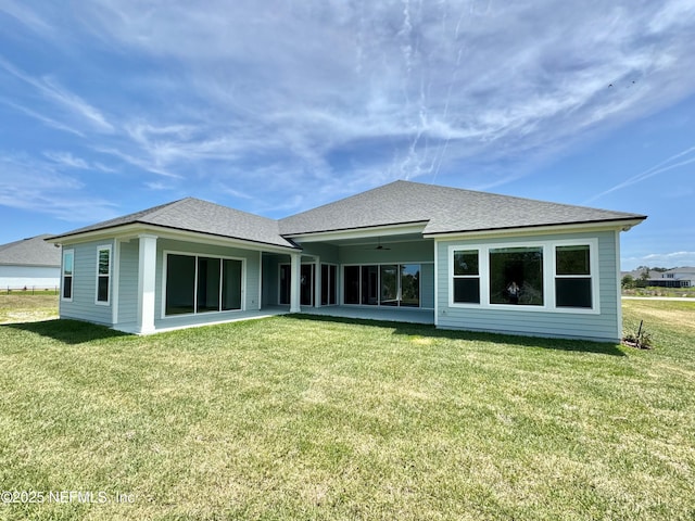 269 Pasarela Dr, Saint Augustine, FL 32095 - rear view of house featuring a lawn, a ceiling fan, roof with shingles, and a patio