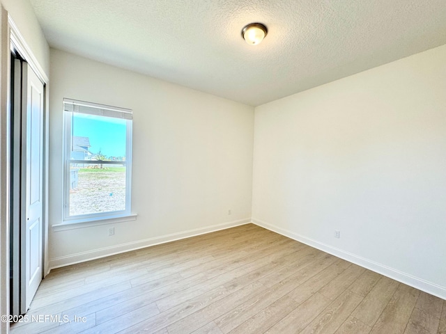 269 Pasarela Dr, Saint Augustine, FL 32095 - unfurnished room featuring baseboards, light wood-type flooring, and a textured ceiling
