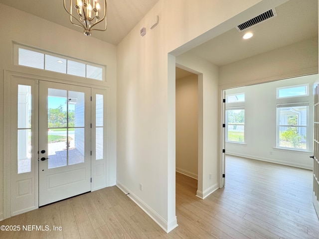 269 Pasarela Dr, Saint Augustine, FL 32095 - foyer entrance with light wood-style floors, baseboards, a notable chandelier, and visible vents