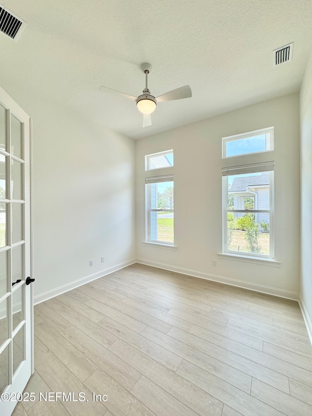 269 Pasarela Dr, Saint Augustine, FL 32095 - empty room featuring visible vents, baseboards, ceiling fan, and light wood-type flooring