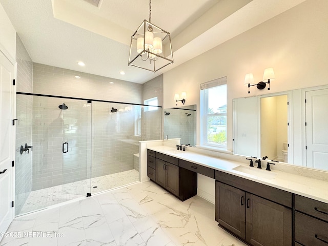 269 Pasarela Dr, Saint Augustine, FL 32095 - bathroom featuring a shower stall, a sink, toilet, an inviting chandelier, and recessed lighting