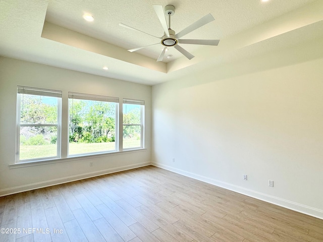 269 Pasarela Dr, Saint Augustine, FL 32095 - unfurnished room featuring baseboards, a ceiling fan, wood finished floors, and a raised ceiling